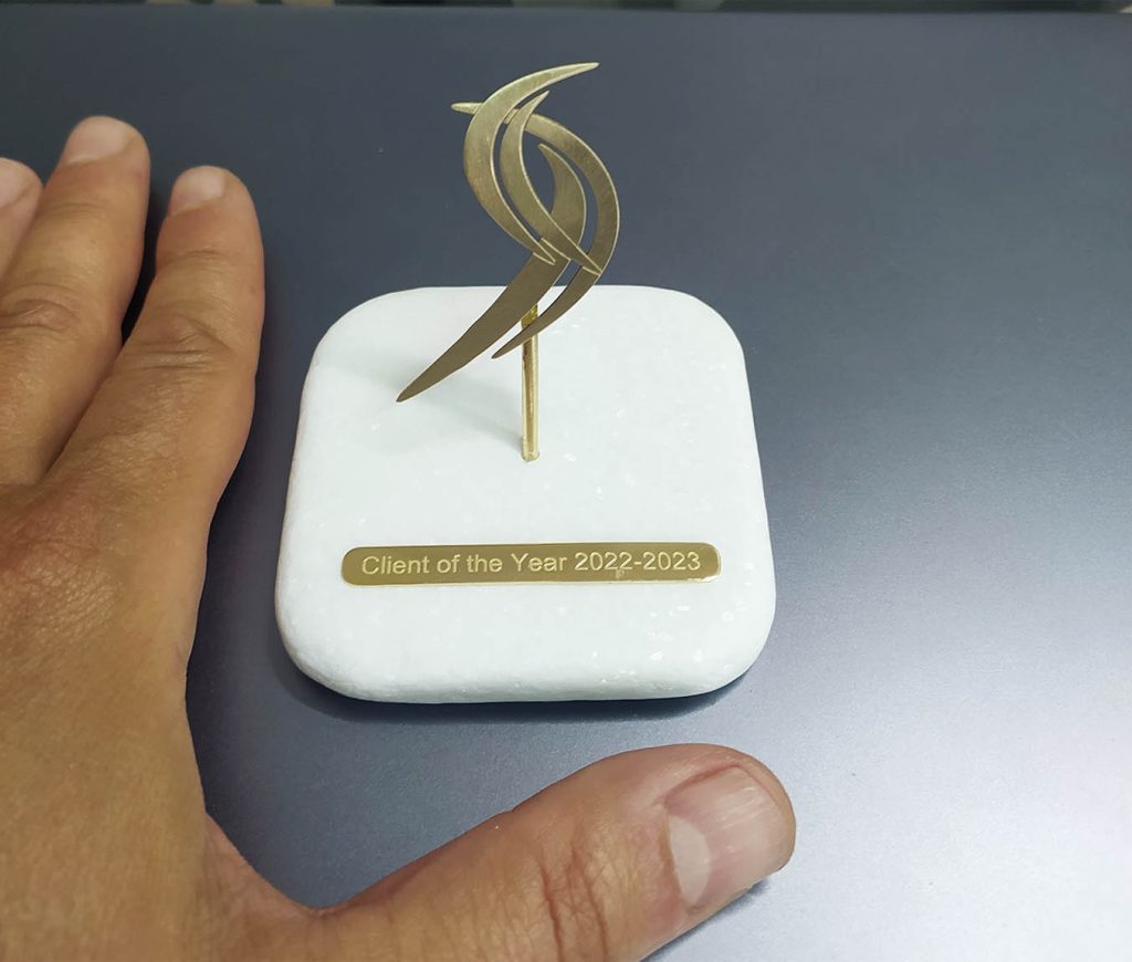 Sarantis Group logo material: Bronze gold plated - marbel usage : Decorative item / press papier